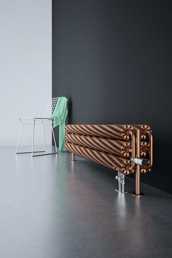 Design- Bodenheizkörper Ribbon HSD Copper frontal mit Thermostatventil neben Stuhl